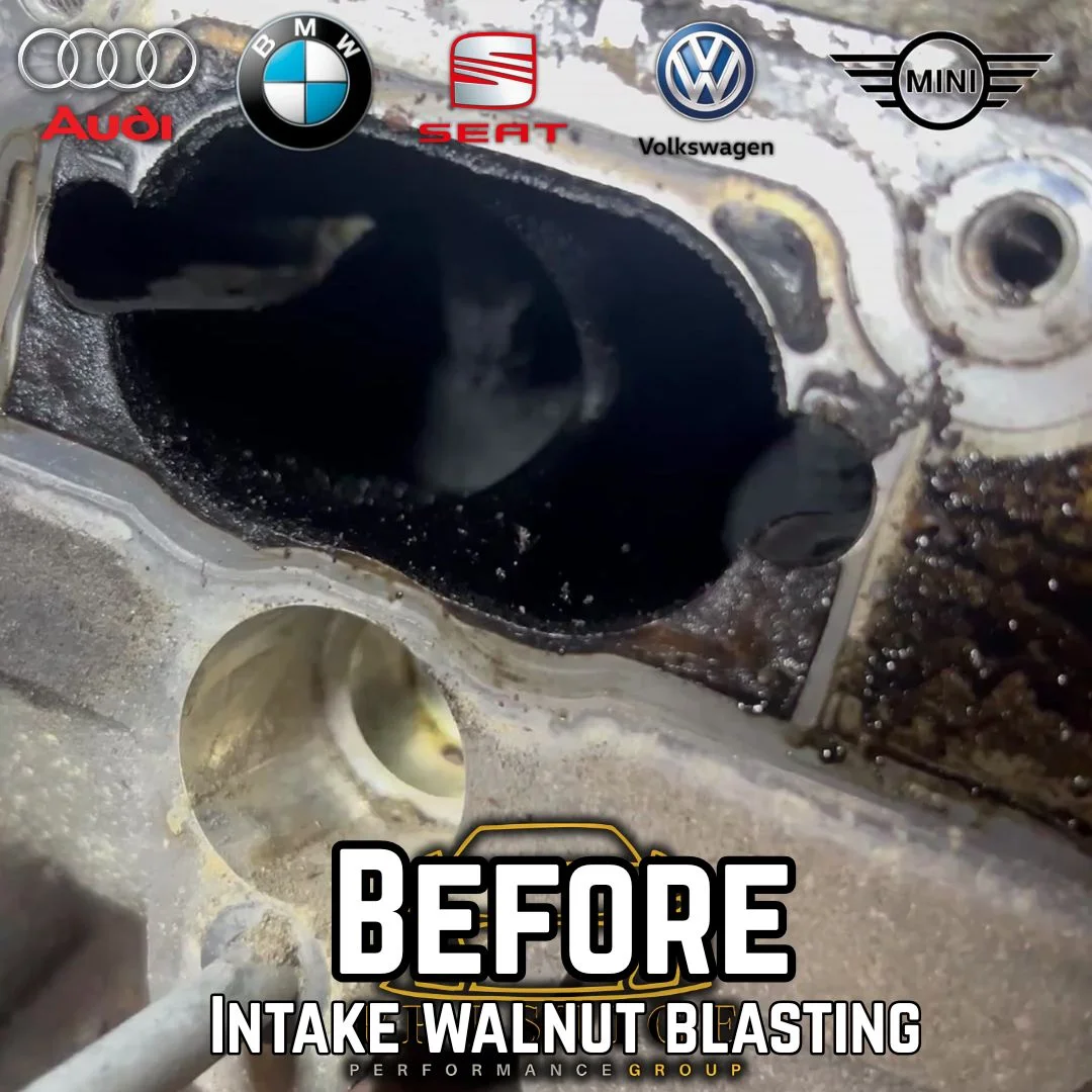 Before-cleaning image showing dark carbon deposits around the intake port and valve surfaces
